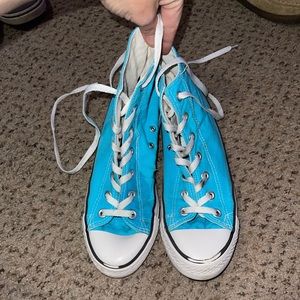 Baby blue, high top converse.